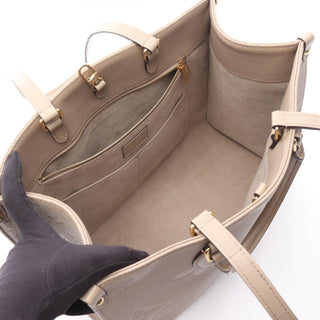 Louis Vuitton On The Go MM - Giant Empreinte Beige