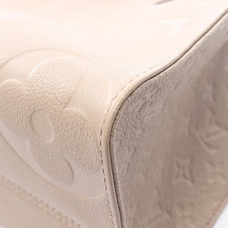 Louis Vuitton On The Go MM - Giant Empreinte Beige